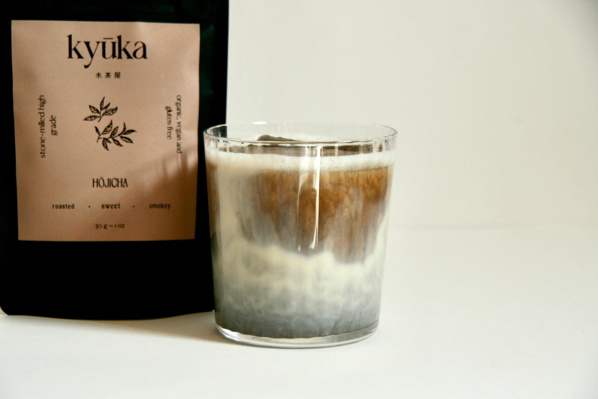 Kyuka Matcha Hojicha tea package and iced hojicha latte on white background